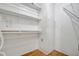 Well-organized closet with shelving, offering practical storage solutions and maximizing space efficiency in a clean environment at 206 S Port Royal Ln, Apollo Beach, FL 33572