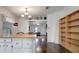 Open dining area with breakfast bar that connects to kitchen and wood floors at 206 S Port Royal Ln, Apollo Beach, FL 33572