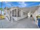 Single-story home featuring a covered carport and adjacent parking for a golf cart at 206 S Port Royal Ln, Apollo Beach, FL 33572