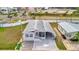 Single-story home with red shutters, a covered carport, and a unique driveway design at 206 S Port Royal Ln, Apollo Beach, FL 33572