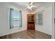 Living room featuring hardwood floors, two windows and a corner cabinet at 206 S Port Royal Ln, Apollo Beach, FL 33572