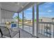 Enclosed porch offering a serene outdoor living space, ideal for enjoying neighborhood views and fresh air at 206 S Port Royal Ln, Apollo Beach, FL 33572