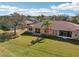 Expansive backyard with lush green grass, perfect for outdoor activities and relaxation at 2471 Kensington Greens Dr, Sun City Center, FL 33573