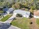 Tranquil aerial view of a home with an expansive, green lawn and inviting, landscaped front yard at 2555 68Th S Ave, St Petersburg, FL 33712