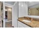 Bathroom featuring granite vanity with white sink and cabinet, tiled shower/tub and white doors at 2555 68Th S Ave, St Petersburg, FL 33712