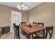 Dining room with classic chandelier and view into other living spaces at 2555 68Th S Ave, St Petersburg, FL 33712