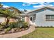 Inviting front entrance with a well-maintained walkway and beautiful landscaping at 2555 68Th S Ave, St Petersburg, FL 33712