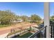 Balcony view overlooking a beautifully landscaped street and glimpses of the water at 2810 W Alline Ave, Tampa, FL 33611