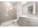 Modern bathroom featuring a glass-enclosed shower, sleek vanity, and stylish tile work at 2810 W Alline Ave, Tampa, FL 33611