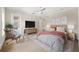 Spacious bedroom with a comfortable bed, modern decor, and access to a private balcony at 2810 W Alline Ave, Tampa, FL 33611