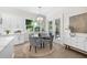 Cozy dining area with modern light fixture and view to patio at 2810 W Alline Ave, Tampa, FL 33611