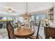 Bright dining area boasting a wood table with stained glass lighting and a ceiling fan at 301 Mariner Dr # 301, Tarpon Springs, FL 34689