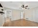 Large bedroom featuring wood floors, an ensuite bathroom, and closet space at 3116 Swan Ln, Safety Harbor, FL 34695