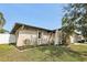 Well-maintained home exterior featuring mature landscaping and manicured lawn at 3116 Swan Ln, Safety Harbor, FL 34695