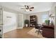 Home office with French doors, modern desk, and built-in bookshelf at 3116 Swan Ln, Safety Harbor, FL 34695