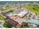 An aerial view of a community with swimming pool, recreation areas, and ample parking and residential neighborhood at 315 Linger Ln, Sun City Center, FL 33573