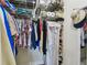 Walk in closet, with shelving, hanging clothes and shoes at 315 Linger Ln, Sun City Center, FL 33573