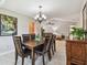 Well-lit dining room with a table, chairs, and decorative furnishings at 315 Linger Ln, Sun City Center, FL 33573