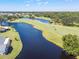 A golf course with lush greenery, winding fairways, and a tranquil lake, inviting golfers of all skill levels at 315 Linger Ln, Sun City Center, FL 33573