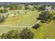 Picturesque golf course with meticulously manicured greens, mature trees, and gently rolling hills at 315 Linger Ln, Sun City Center, FL 33573