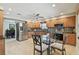 Well-lit kitchen with stainless steel appliances and granite countertops at 315 Linger Ln, Sun City Center, FL 33573