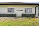 Exterior of the community library featuring large windows and landscaping, inviting readers of all ages at 315 Linger Ln, Sun City Center, FL 33573