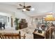 Living room showcasing tile floors, a ceiling fan, and comfortable seating at 315 Linger Ln, Sun City Center, FL 33573