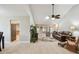 Bright living room with tile floors, ceiling fan, and comfortable seating at 315 Linger Ln, Sun City Center, FL 33573