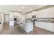 Modern kitchen with white cabinets, granite countertops, and island at 3428 Hazel Hollow Way, Plant City, FL 33565