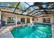 Inviting screened pool with canal views at 4346 Marine Pkwy, New Port Richey, FL 34652