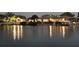 Waterfront view of community center and boat slips on canal at dusk at 4346 Marine Pkwy, New Port Richey, FL 34652