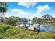 Private dock on calm waters with lush greenery in the foreground at 4346 Marine Pkwy, New Port Richey, FL 34652