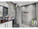 Modern gray bathroom with patterned shower curtain at 4408 W Minnehaha St, Tampa, FL 33614