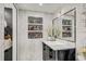 Bathroom with marble vanity and built-in shelving at 4408 W Minnehaha St, Tampa, FL 33614