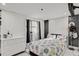 Bedroom with white dresser and patterned bedding at 4408 W Minnehaha St, Tampa, FL 33614