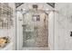 Walk-in shower with mosaic tile and glass enclosure at 4408 W Minnehaha St, Tampa, FL 33614