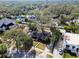 Aerial view of a single-story home featuring mature landscaping, and a well-manicured lawn at 4532 W Beachway Dr, Tampa, FL 33609