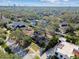 An aerial view showcases neighborhood houses, mature landscaping, and trees at 4532 W Beachway Dr, Tampa, FL 33609