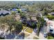 Aerial view of a single-story home featuring mature landscaping, and a well-manicured lawn at 4532 W Beachway Dr, Tampa, FL 33609