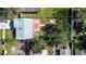 Aerial view of the property showcasing a large, fenced backyard with a patio and mature trees at 4570 69Th N Ave, Pinellas Park, FL 33781