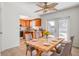 Dining area adjacent to the kitchen features a ceiling fan and double doors to the backyard at 4570 69Th N Ave, Pinellas Park, FL 33781