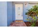 Inviting front door with decorative glass, a welcome mat, and stylish exterior lighting at 4570 69Th N Ave, Pinellas Park, FL 33781