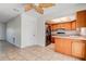 Cozy kitchen area featuring warm wood cabinetry, tile flooring, and modern appliances at 4570 69Th N Ave, Pinellas Park, FL 33781