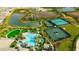 Aerial view showcasing the community pool and tennis courts at 4576 Garofalo Rd, Wesley Chapel, FL 33543