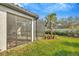 A view from the backyard of the screened in lanai on this home at 4576 Garofalo Rd, Wesley Chapel, FL 33543