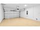 Spacious two-car garage featuring an epoxy floor and automatic door opener at 4576 Garofalo Rd, Wesley Chapel, FL 33543