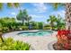 Relax in this cozy hot tub surrounded by tropical landscaping at 4576 Garofalo Rd, Wesley Chapel, FL 33543