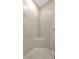 Tiled shower stall with seat at 4576 Garofalo Rd, Wesley Chapel, FL 33543