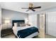 A beautifully staged bedroom featuring a plush bed, stylish nightstands, and a ceiling fan at 505 67Th Ave # 5, St Pete Beach, FL 33706