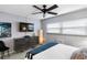 Relaxing bedroom with TV, dresser, natural lighting, and ceiling fan at 505 67Th Ave # 5, St Pete Beach, FL 33706